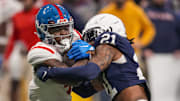 Mississippi Rebels running back Quinshon Judkins is tackled by Penn State Nittany Lions safety Kevin Winston Jr.. Mandatory Credit: Dale Zanine-Imagn Images