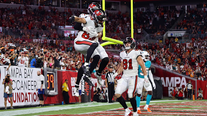 Aug 23, 2024; Tampa, Florida, USA;  Tampa Bay Buccaneers wide receiver Tanner Knue (80) is congratulated by Tampa Bay Buccaneers wide receiver Cody Thompson (83) after he scored a touchdown  M during the second half at Raymond James Stadium. Mandatory Credit: Kim Klement Neitzel-USA TODAY Sports