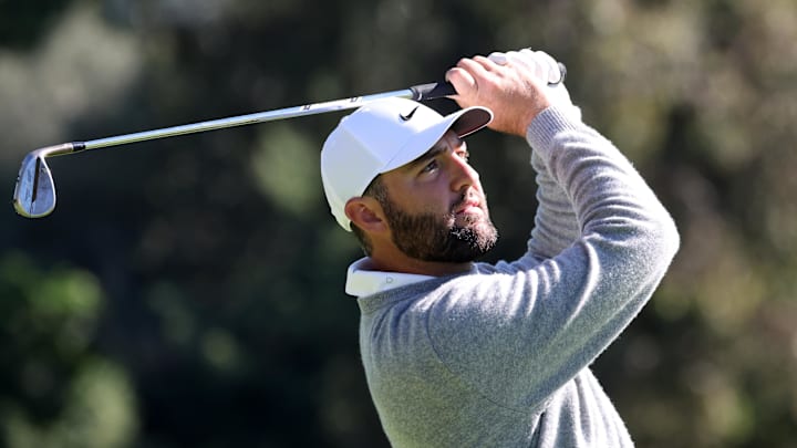 Scottie Scheffler hits his fairway shot on the 13th hole during the third round of The Genesis Invitational