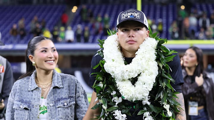 Dec 7, 2024; Indianapolis, IN, USA; Oregon Ducks quarterback Dillon Gabriel (8) walks around the field after defeating the Penn State Nittany Lions to win the Big Ten Championship in the 2024 Big Ten Championship game at Lucas Oil Stadium. 