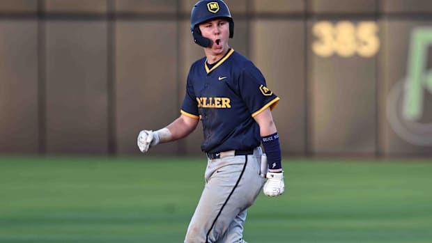 Moeller's Matt Ponatoski (29) reacts after a home run during their baseball game against Mason.