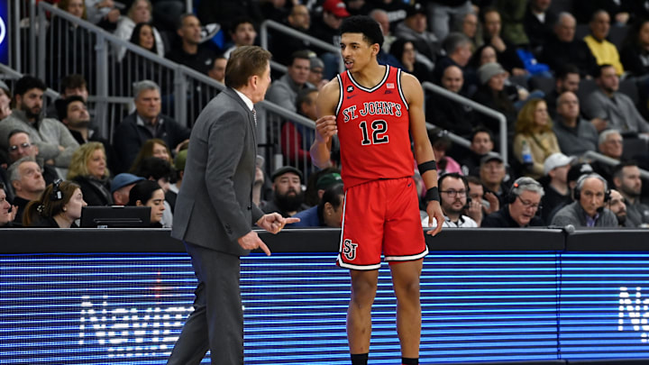 Feb 13, 2024; Providence, Rhode Island, USA; St. John's Red Storm guard RJ Luis Jr. (12)  speaks to head coach Rick Pitino during the second half against the Providence Friars at Amica Mutual Pavilion. Mandatory Credit: Eric Canha-Imagn Images