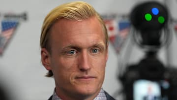 Dec 15, 2022; Henderson, Nevada, USA; Team USA head coach John Wroblewski takes questions from reporters after Team Canada defeated Team USA 3-2 in a Rivalry Series women's ice hockey game at Dollar Loan Center. Mandatory Credit: Stephen R. Sylvanie-Imagn Images