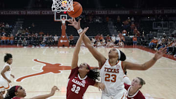 Jan 9, 2025; Austin, Texas, USA; Texas Longhorns forward Aaliyah Moore (23) and Alabama Crimson Tide guard Aaliyah Nye (32) reach for a rebound during the second half at Moody Center. Mandatory Credit: Scott Wachter-Imagn Images