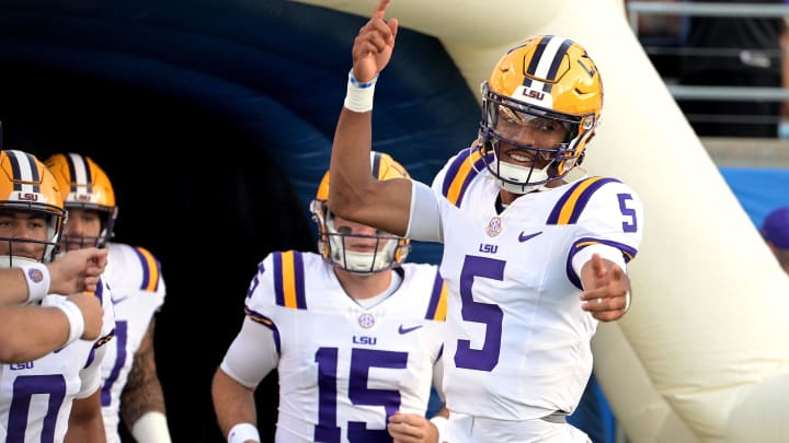 Sep 3, 2023; Orlando, Florida, USA; LSU Tigers quarterback Jayden Daniels (5) leads the quarterbacks onto the field before the game against the Florida State Seminoles at Camping World Stadium. Mandatory Credit: Melina Myers-USA TODAY Sports