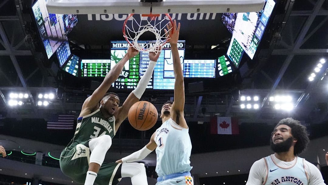 Milwaukee Bucks forward Giannis Antetokounmpo (34) dunks in front of San Antonio Spurs forward Victor Wembanyama (1) during the first quarter at Fiserv Forum. Milwaukee Bucks forward Giannis Antetokounmpo (34) dunks in front of San Antonio Spurs forward Victor Wembanyama (1) during the first quarter at Fiserv Forum.