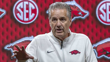 Arkansas Razorbacks coach John Calipari talks with the media during SEC Media Day at Grand Bohemian Hotel.