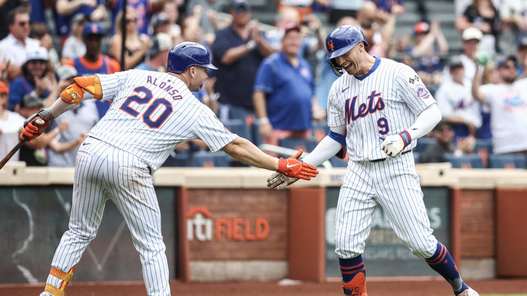 Jun 30, 2024; New York City, New York, USA;  New York Mets center fielder Brandon Nimmo (9) celebrates with first baseman Pete Alonso (20) after hitting a two run home run to tie the game in the seventh inning against the Houston Astros at Citi Field. Mandatory Credit: Wendell Cruz-USA TODAY Sports