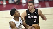 Apr 23, 2025; Cleveland, Ohio, USA; Cleveland Cavaliers forward De'Andre Hunter (12) looks to the basket beside Miami Heat forward Nikola Jovic (5) in the fourth quarter of game two of the first round of the 2025 NBA Playoffs at Rocket Arena. Mandatory Credit: David Richard-Imagn Images