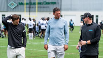 Jacksonville Jaguars general manager James Gladstone, left, Jacksonville Jaguars is executive vice president of football operations Tony Boselli, center and Jacksonville Jaguars head coach Liam Coen, right, all talk on the field after the Jacksonville Jaguars’ mandatory minicamp Tuesday June 10, 2025 at the Miller Electric Center in Jacksonville, Fla. 