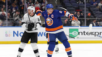 Dec 10, 2024; Elmont, New York, USA; New York Islanders left wing Anders Lee (27) celebrates his goal against Los Angeles Kings defenseman Vladislav Gavrikov (84) during the second period at UBS Arena. Mandatory Credit: Brad Penner-Imagn Images