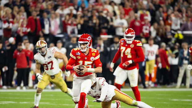 Kansas City Chiefs quarterback Patrick Mahomes (15) runs the ball against the San Francisco 49ers during Super Bowl LVIII at 