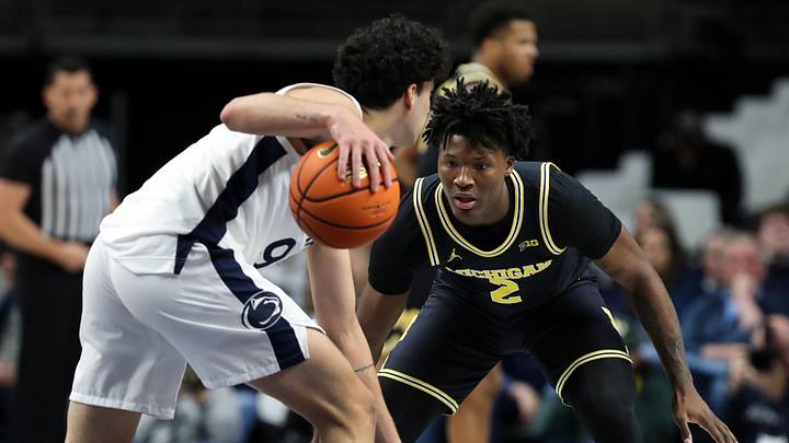 Jan 6, 2026; University Park, Pennsylvania, USA; Michigan Wolverines guard LJ Cason (2) defends Penn State Nittany Lions guard Melih Tunca (9) during the second half at Bryce Jordan Center. Mandatory Credit: Matthew O'Haren-Imagn Images