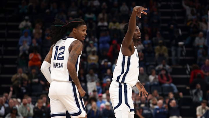 Nov 25, 2024; Memphis, Tennessee, USA; Memphis Grizzlies guard Ja Morant (12) and forward Jaren Jackson Jr. (13) react during the second half against the Portland Trail Blazers at FedExForum. Mandatory Credit: Petre Thomas-Imagn Images