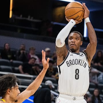 Apr 1, 2024; Indianapolis, Indiana, USA; Brooklyn Nets guard Lonnie Walker IV (8) shoots the ball while Indiana Pacers guard Kendall Brown (10) defends in the second half at Gainbridge Fieldhouse. Mandatory Credit: Trevor Ruszkowski-Imagn Images