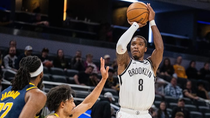 Apr 1, 2024; Indianapolis, Indiana, USA; Brooklyn Nets guard Lonnie Walker IV (8) shoots the ball while Indiana Pacers guard Kendall Brown (10) defends in the second half at Gainbridge Fieldhouse. Mandatory Credit: Trevor Ruszkowski-Imagn Images