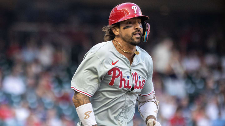 Aug 22, 2024; Cumberland, Georgia, USA; Philadelphia Phillies outfielder Nick Castellanos (8) runs to first base after hitting a ground ball against Atlanta Braves during the first inning at Truist Park