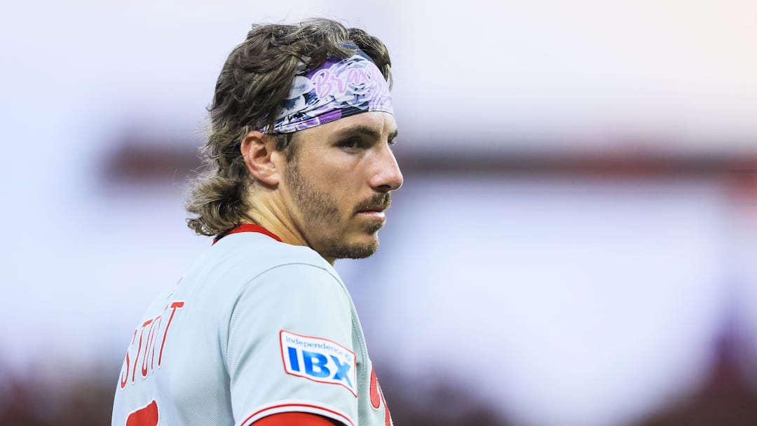 Aug 13, 2025; Cincinnati, Ohio, USA; Philadelphia Phillies second baseman Bryson Stott (5) stands on the field during a pitching change in the eighth inning against the Cincinnati Reds at Great American Ball Park.