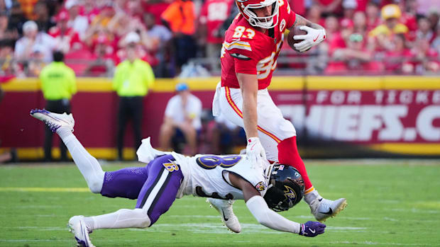 Kansas City Chiefs tight end Noah Gray (83) evades a tackle from Baltimore Ravens cornerback Keyon Martin (38) in Week 4.
