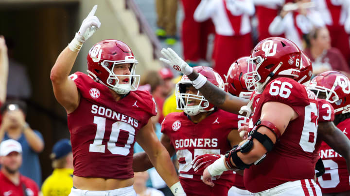 Aug 30, 2024; Norman, Oklahoma, USA; Oklahoma Sooners tight end Bauer Sharp (10) celebrates with teammates after catching a touchdown pass during the first quarter against the Temple Owls  at Gaylord Family-Oklahoma Memorial Stadium.