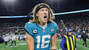 Jan 14, 2023; Jacksonville, Florida, USA; Jacksonville Jaguars quarterback Trevor Lawrence (16) celebrates after beating the Los Angeles Chargers during a wild card game at TIAA Bank Field. Mandatory Credit: Nathan Ray Seebeck-Imagn Images