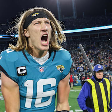 Jan 14, 2023; Jacksonville, Florida, USA; Jacksonville Jaguars quarterback Trevor Lawrence (16) celebrates after beating the Los Angeles Chargers during a wild card game at TIAA Bank Field. Mandatory Credit: Nathan Ray Seebeck-Imagn Images