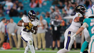 Baltimore Ravens running back Derrick Henry (22) runs for a gain during the fourth quarter against the Miami Dolphins at Hard Rock Stadium. 