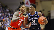Nov 27, 2025; Kissimmee, Florida, USA; Brigham Young University Cougars forward AJ Dybantsa (3) is guarded by Miami (FL) Hurricanes forward Shelton Henderson (7) in the second half at State Farm Field House. Mandatory Credit: Nathan Ray Seebeck-Imagn Images