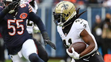 Oct 19, 2025; Chicago, Illinois, USA; New Orleans Saints running back Alvin Kamara (41) rushes the ball against the Chicago Bears during the second half at Soldier Field. Mandatory Credit: Mike Dinovo-Imagn Images