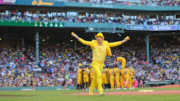 Boston MA-Team owner Jesse Cole runs toward the stands with tee shirts during the Savannah Bananas first Banana Ball game at Fenway Park on Saturday, June 8, 2024.