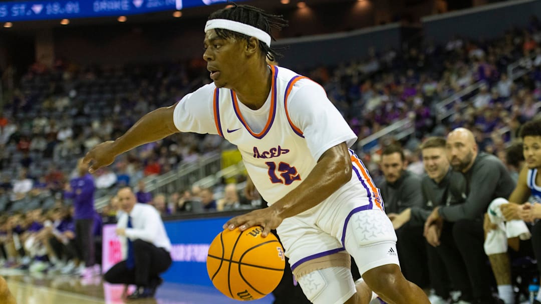 Evansville's Tayshawn Comer (12) drives as the Evansville Purple Aces play the Drake Bulldogs at Ford Center in Evansville, Ind., Wednesday, Feb. 26, 2025.
