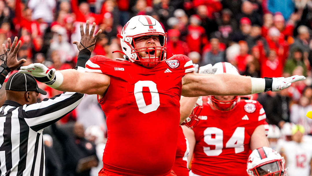 Nov 11, 2023; Lincoln, Nebraska, USA; Nebraska Cornhuskers defensive lineman Nash Hutmacher (0) celebrates after getting a stop on fourth down against the Maryland Terrapins during the third quarter at Memorial Stadium.