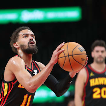 Mar 12, 2025; Atlanta, Georgia, USA; Atlanta Hawks guard Trae Young (11) shoots at the line against the Charlotte Hornets during the first quarter at State Farm Arena. Mandatory Credit: Mady Mertens-Imagn Images