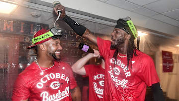 Sep 28, 2025; Milwaukee, Wisconsin, USA;  Cincinnati Reds shortstop Elly De La Cruz (right) celebrates after the Reds clinched a wild card spot after the game against the Milwaukee Brewers at American Family Field. Mandatory Credit: Benny Sieu-Imagn Images