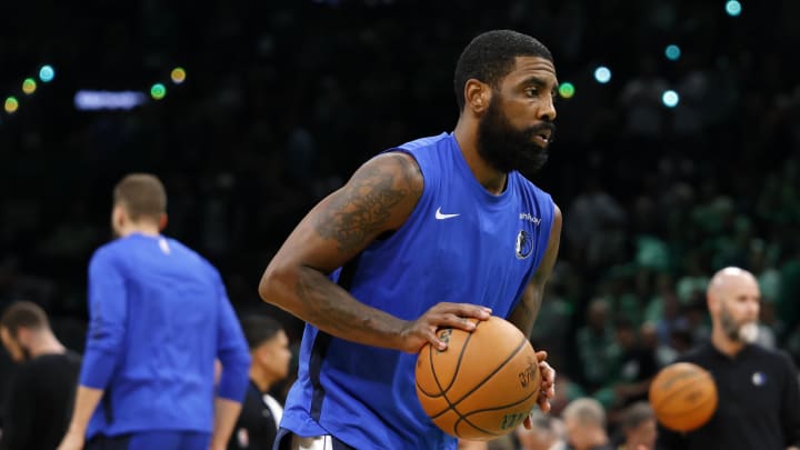 Dallas Mavericks guard Kyrie Irving (11) warms up before game two of the 2024 NBA Finals between the Boston Celtics and the Dallas Mavericks at TD Garden. Mandatory Credit: