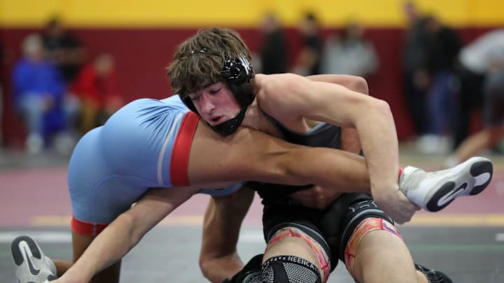 Blake Bartos of Buckeye (right) works against Jayden Raney of Union County during their 132 pound match in the quarterfinal round of the 2024 Ironman Wrestling Tournament at Walsh Jesuit High School on Friday, Dec. 6, 2024, in Cuyahoga Falls, Ohio. Blake Bartos of Buckeye (right) works against Jayden Raney of Union County during their 132 pound match in the quarterfinal round of the 2024 Ironman Wrestling Tournament at Walsh Jesuit High School on Friday, Dec. 6, 2024, in Cuyahoga Falls, Ohio.