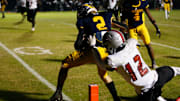 Prince Avenue's Hudson Hill (2) competes with Irwin County's Tyon Jones (12) to get into the in zone for a touchdown during a GHSA high school football playoff game against Irwin County in Bogart, Ga., on Friday, Nov. 24, 2023. Prince Avenue won 41-7.