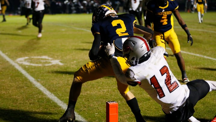 Prince Avenue's Hudson Hill (2) competes with Irwin County's Tyon Jones (12) to get into the in zone for a touchdown during a GHSA high school football playoff game against Irwin County in Bogart, Ga., on Friday, Nov. 24, 2023. Prince Avenue won 41-7.