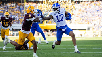 Nov 23, 2024; Tempe, Arizona, USA; Brigham Young Cougars wide receiver Keelan Marion (17) runs for a touchdown against the Arizona State Sun Devils in the second half at Mountain America Stadium. Mandatory Credit: Mark J. Rebilas-Imagn Images
