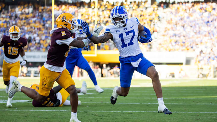 Nov 23, 2024; Tempe, Arizona, USA; Brigham Young Cougars wide receiver Keelan Marion (17) runs for a touchdown against the Arizona State Sun Devils in the second half at Mountain America Stadium. Mandatory Credit: Mark J. Rebilas-Imagn Images Nov 23, 2024; Tempe, Arizona, USA; Brigham Young Cougars wide receiver Keelan Marion (17) runs for a touchdown against the Arizona State Sun Devils in the second half at Mountain America Stadium. Mandatory Credit: Mark J. Rebilas-Imagn Images