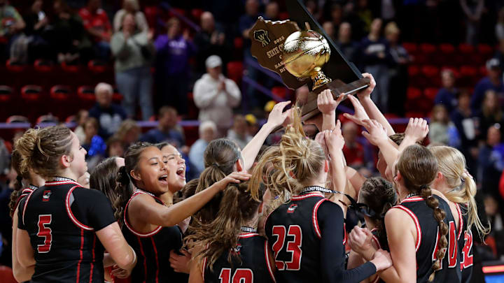 The Oostburg High School girls basketball team celebrates after winning the WIAA Division 3 state championship on March 15, 2025, at the Resch Center in Ashwaubenon, Wis. The Oostburg High School girls basketball team celebrates after winning the WIAA Division 3 state championship on March 15, 2025, at the Resch Center in Ashwaubenon, Wis.