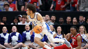 Mar 31, 2024; Dallas, TX, USA; Duke basketball guard Tyrese Proctor (5) controls the ball against North Carolina State Wolfpack guard Jayden Taylor (1) in the second half in the finals of the South Regional of the 2024 NCAA Tournament at American Airline Center.