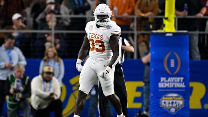 Jan 10, 2025; Arlington, TX, USA; Texas Longhorns linebacker David Gbenda (33) in action during the game between the Texas Longhorns and the Ohio State Buckeyes at AT&T Stadium. Mandatory Credit: Jerome Miron-Imagn Images Jan 10, 2025; Arlington, TX, USA; Texas Longhorns linebacker David Gbenda (33) in action during the game between the Texas Longhorns and the Ohio State Buckeyes at AT&T Stadium. Mandatory Credit: Jerome Miron-Imagn Images