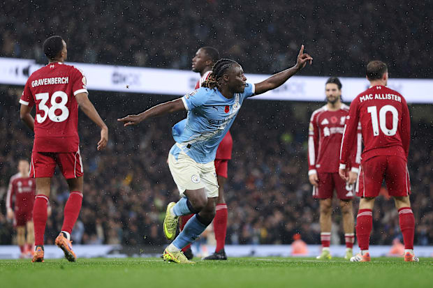 Jérémy Doku (centre) celebrating against Liverpool.