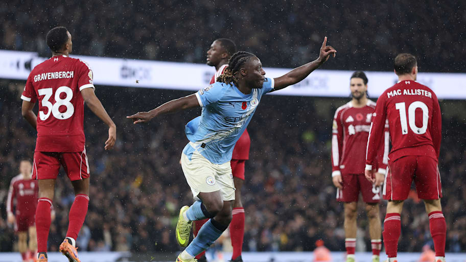 Jérémy Doku (centre) celebrating against Liverpool.