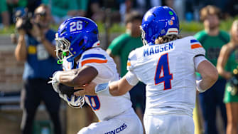 Oct 4, 2025; South Bend, Indiana, USA; Boise State Broncos quarterback Maddux Madsen (4) hands off to running back Sire Gaines (26) against the Notre Dame Fighting Irish during the first half at Notre Dame Stadium.