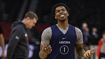 Mar 26, 2025; Newark, NJ, USA; Arizona Wildcats guard Caleb Love (1) reacts during a practice session in front of head coach Tommy Lloyd in preparation for an East Regional semifinal game against the Duke basketball team at Prudential Center.