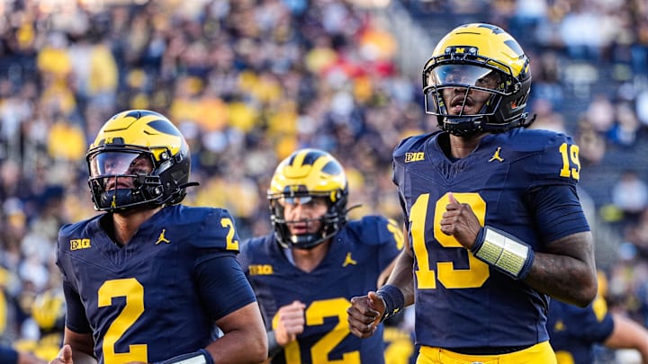 Michigan quarterback Bryce Underwood (19), right, and quarterback Jadyn Davis (2), left, warm up ahead of the New Mexico game at Michigan Stadium in Ann Arbor on Saturday, August 30, 2025.