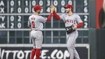 Sep 22, 2024; Houston, Texas, USA; Los Angeles Angels shortstop Zach Neto (9) celebrates with left fielder Taylor Ward (3) after the game against the Houston Astros at Minute Maid Park. Mandatory Credit: Troy Taormina-Imagn Images