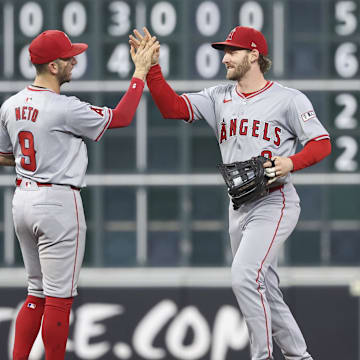 Sep 22, 2024; Houston, Texas, USA; Los Angeles Angels shortstop Zach Neto (9) celebrates with left fielder Taylor Ward (3) after the game against the Houston Astros at Minute Maid Park. Mandatory Credit: Troy Taormina-Imagn Images
